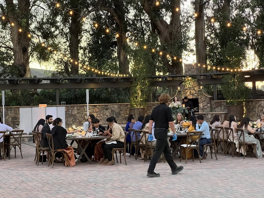 Outdoor wedding dinner in Moorpark at sundown