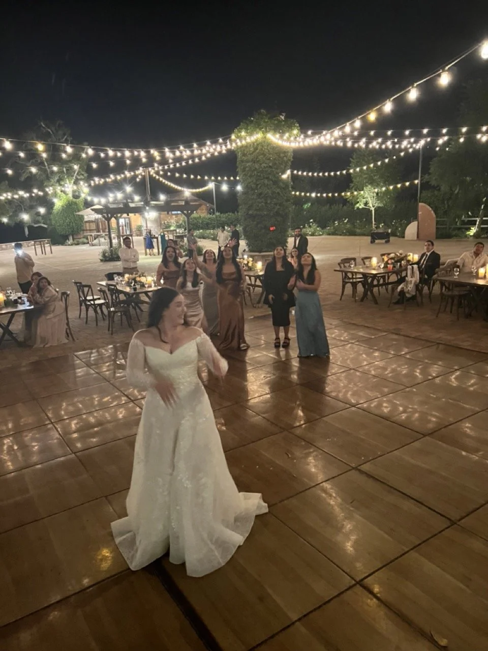 Bride's bouquet toss outdoor wedding in Moorpark 