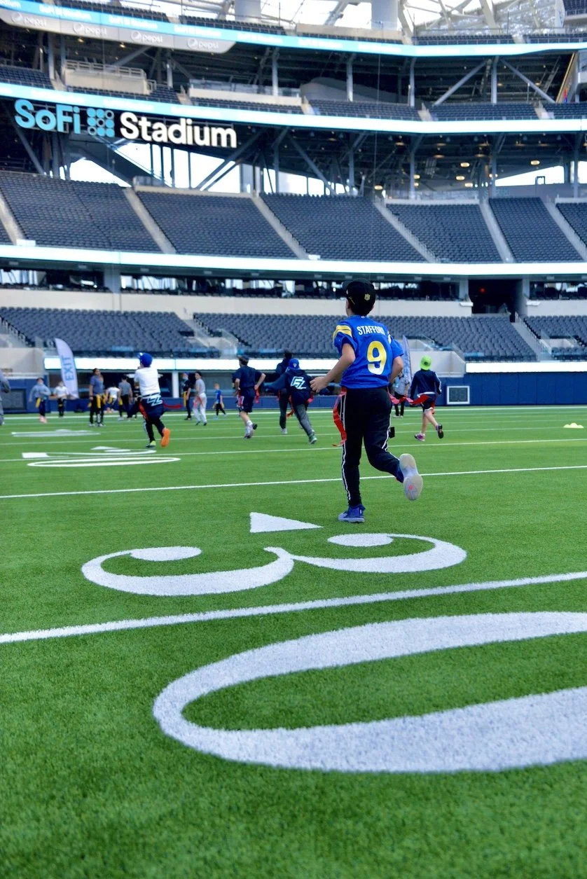 Bar Mitzvah guests playing flag football at SOFI stadium in Los Angeles Ca.